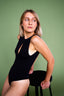 MILLO model posing with a high chair in body LIOR.